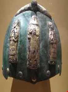 Helmet with divine figures beneath a bird with outstretched wings
